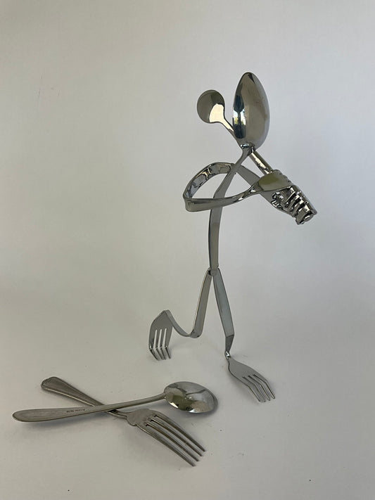 A hand made cutlery figure of ‘The Golfer’
